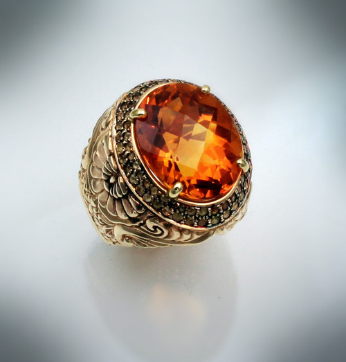 R 1178 has a 16mm oval Citrine with checkerboard face set with two rows of yellow sapphires in 14 kt yellow gold.  Weight 17 grams. 