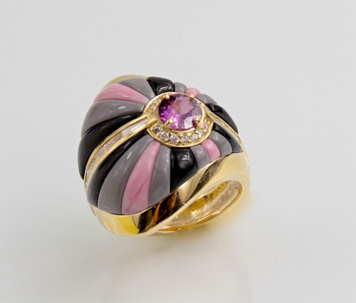 R-559 ring has a 5.5mm purple sapphire as the center stone surrounded by 14 round pave` F color VS clarity diamonds, has 6 baguettes of F/VS diamonds with rays of hand carved black jade, rhodonite, and grey jasper, set in 14kt yellow gold. 
Side view