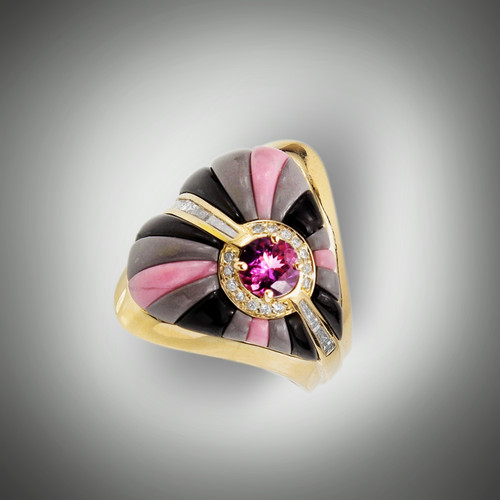 R-559 ring has a 5.5mm purple sapphire as the center stone surrounded by 14 round pave` F color VS clarity diamonds, has 6 baguettes of F/VS diamonds with rays of hand carved black jade, rhodonite, and grey jasper, set in 14kt yellow gold. 
Side view