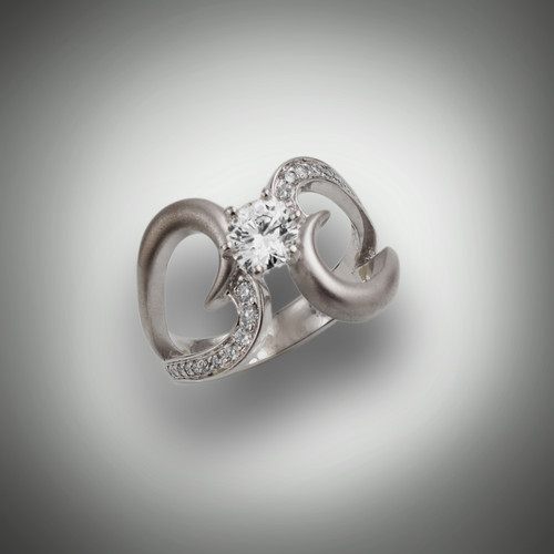 R 733 center stone is 0.70 round brilliant G color VS2 clarity with 28 pave` F/VS round diamonds weighting .75 points set in 14kt white gold.  If you have your own diamond we can set it for you.  Can be ordered in yellow gold too.  