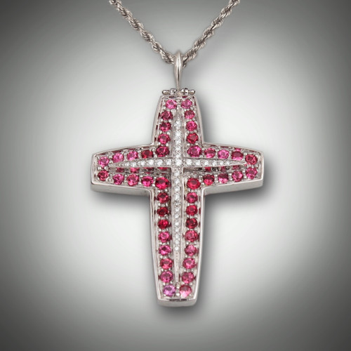 Pnd 288 cross of 33 pave F/VS diamonds weighting 0.25ct and outlined with 44 pink spinel weighting 2.64cts set in 14kt white gold.  