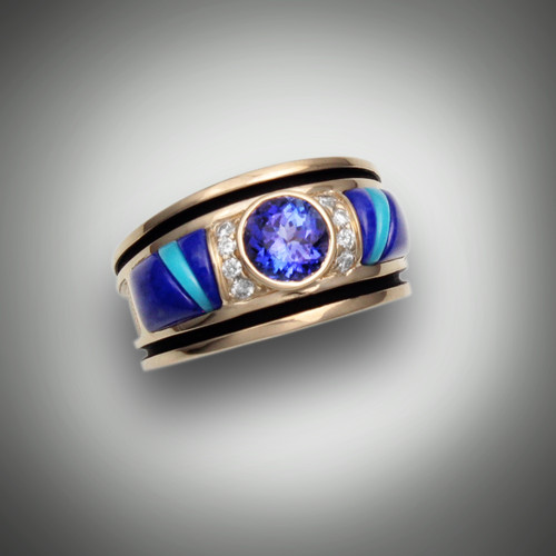 R-689 has a 6mm tanzanite center stone with 8 pave` 10 points total F/VS diamonds, the inlay stones are lapis and turquoise set in 14kt yellow gold. 