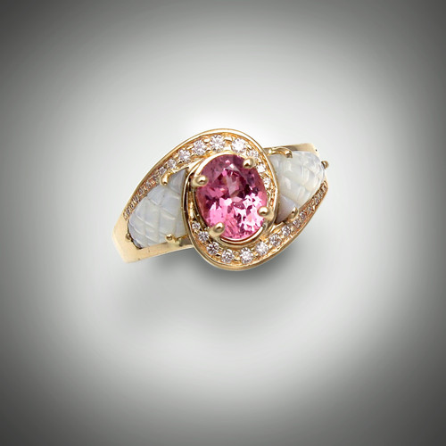 Ring 510 has a 7x5mm oval pink spinel as the center stone and is surrounded by 24 points pave` F/VS diamonds the inlay stone is hand carved pineapple cut black jade set in 14 karat yellow gold. 