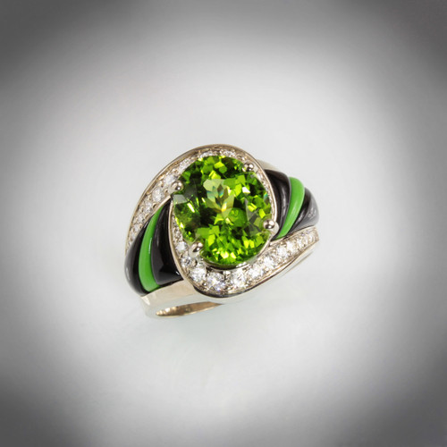 R 510 Peridot has a 11X9mm Oval Peridot with 36 diamonds totaling .40ct weight and sculpted Black Jade and Gaspeite set in 14k white gold
