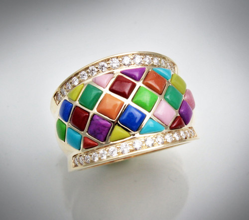 R-1072 has 24 hand carved stones of pink rhodonite, yellow turquoise, purple turquoise, chrysoprase, turquoise, orange jasper, gaspeite, red jasper and lapis with two boarders of 38 pave F/VS diamonds of 35 points set in 6.8 grams of 14 kt yellow gold.