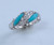 R-193 White gold women's ring set with turquoise and .12twt diamonds.  Can be set with Mother of pearl, lapis, or black jade.