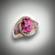 R-510 has a 11X9mm oval pink tourmaline surrounded by .42ct round diamond pave` of F color and VS clarity with 2 pieces grey jasper, 2 pieces of pink rhodonite, and 2 pieces of black jade all hand carved set in 14kt yellow gold.  