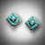 ER 129 earrings have a 5mm round swiss blue topaz and turquoise inlay and a 3 point F/VS pave` diamond on the bottom.