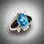 R 705-942 ring has a 11 x 9mm oval swiss blue topaz about 5.5ct with 2-10point marquise diamonds and 35 points of pave` F/VS diamonds with hand carved black jade set in 14kt white gold.  