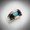 R 801 bg had  Black Jade surrounding blue-green Australian Opal with Pave' Diamonds and a black oxidation line.