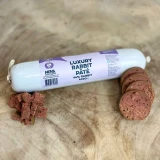 Rabbit pâté for dogs sliced from the roll