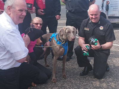 Kaizer handing over some pet oxygen masks to the local fire station with help from smokey paws charity