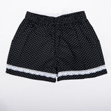 Black micro-dot girls shorts with delicate lace trims and side pockets