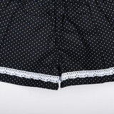 A soft white lace trim decorates the hem