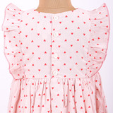 flutter sleeves that are picot edged with back-button opening