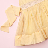 a soft gathered tulle skirt with extra volume that comes from a concealed net band on the skirt lining.