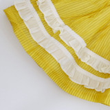layered ivory ruffles on hem