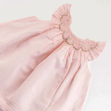 Hand-smocked embroidered neckline with flutter sleeves