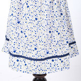 navy trim on hemline of boutique floral bishop dress