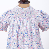 hand smocking on neckline and pink ric rac trims on sleeves