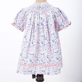 ric rac trims on hem of bishop smocked dress