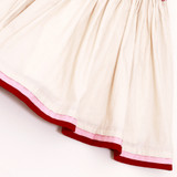 gathered skirt with piped hem accents