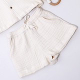 Ecru shorts featuring an elasticated waist and faux drawstring.