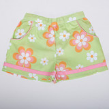 Green floral shorts with fabric piping at the hem and functional side pockets