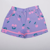 Lilac cherry print girls’ shorts with contrast cord piping detail on the side pockets