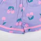 Contrast fabric trims along the hemline adding a neat and playful touch