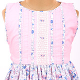 White lace on the bodice with tiny flower embroidery and pintuck details