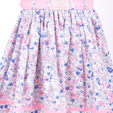 Floral printed skirt with pink fabric trim along the hem