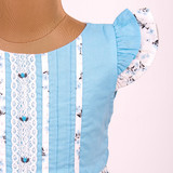 Soft flutter sleeves adding a graceful and airy touch.