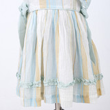 Soft ruffles along the hemline adding a charming touch.