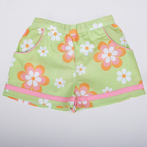 Green floral shorts with fabric piping at the hem and functional side pockets