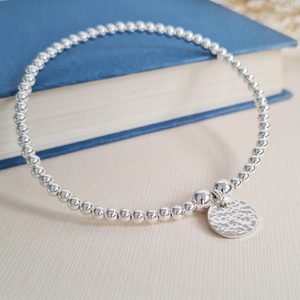 Sterling Silver Stretch Bracelet with Hammered Charm Sterling Silver Stretch Bracelet with Hammered Charm