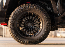 Satin Black Vossen HFX-4 18x9s on 33x12.50R18 tires; pictured here on a Tacoma TRD Pro. ET0 gives it that wide, planted look that just works.