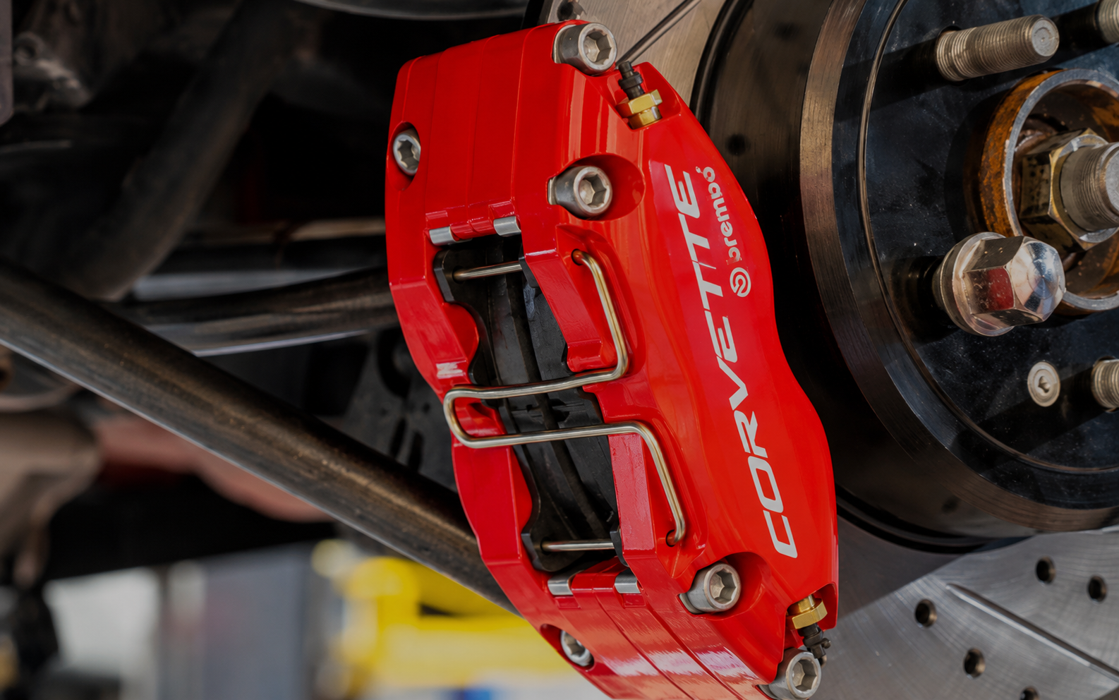 Red Corvette Brembo brake caliper on a vehicle