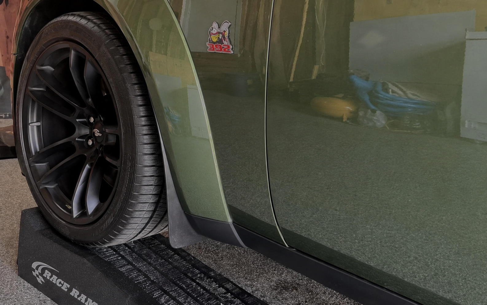 Race Ramps vehicle ramp under a car wheel