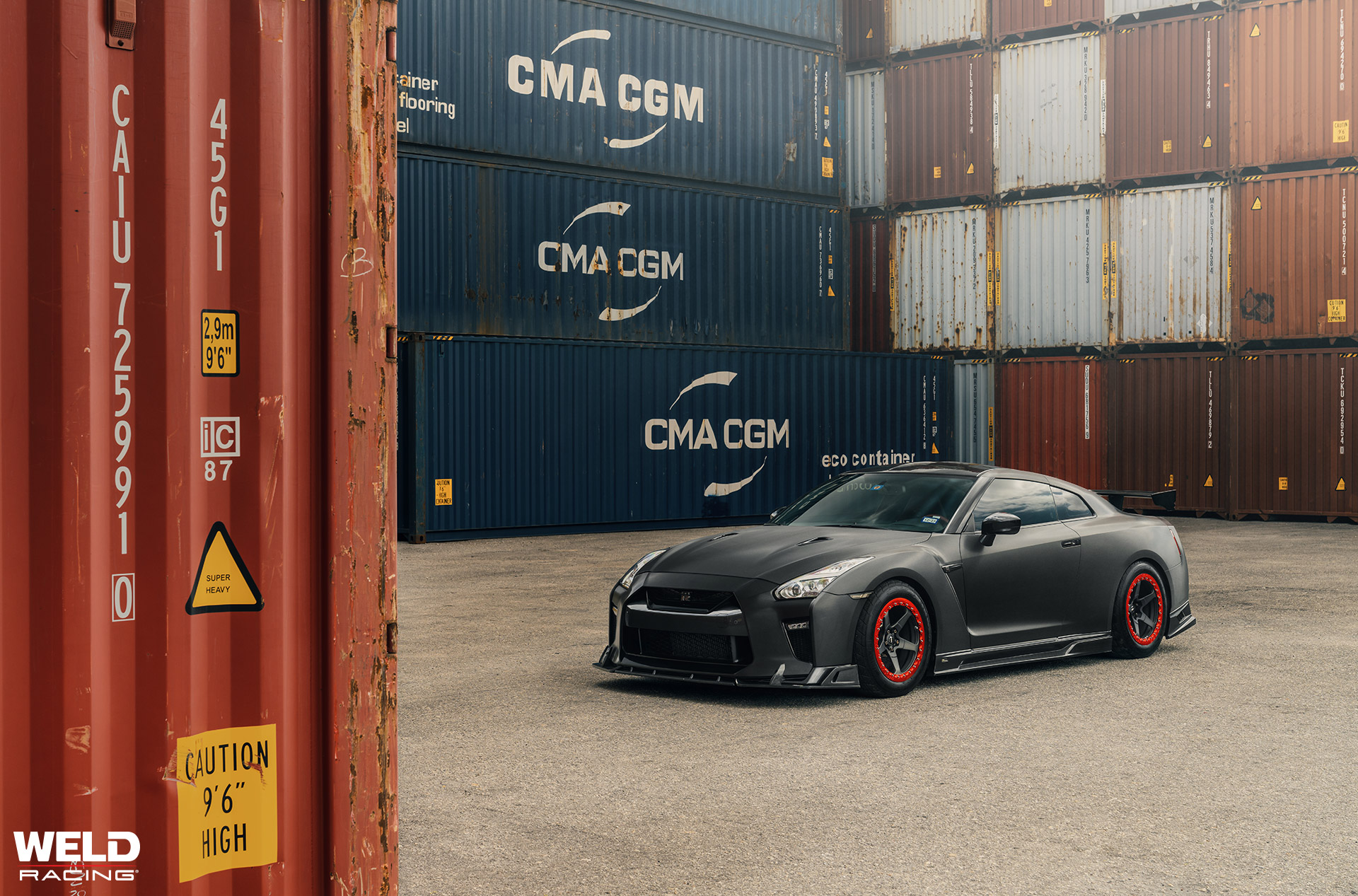 weld-s-new-rm505-wheels-in-a-matte-liquid-smoke-finish-with-gloss-red-beadlock-rings-on-this-nissan-gt-r-r35-1.jpeg