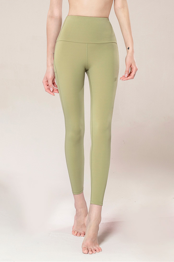 Women's Solid Stash Pocket Tights in Green by BURACQ