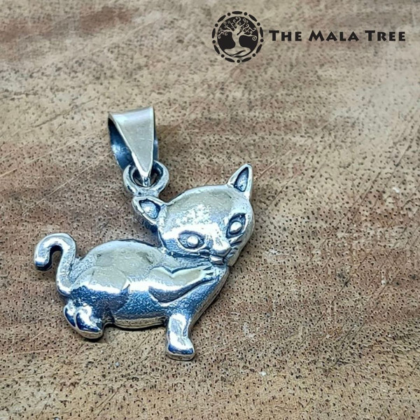 Cat Licking Its Paw Silver Pendant