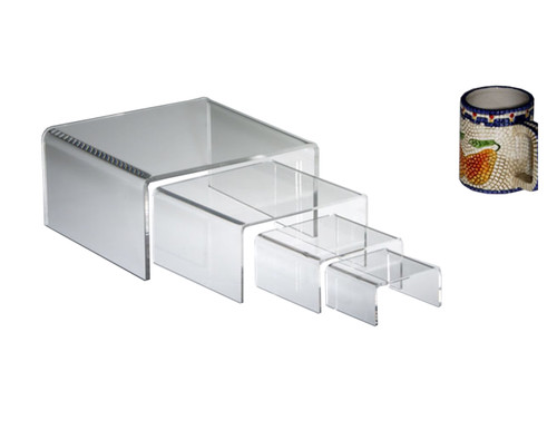Clear acrylic half-height rectangular risers in multiple sizes, a versatile option for retail display.