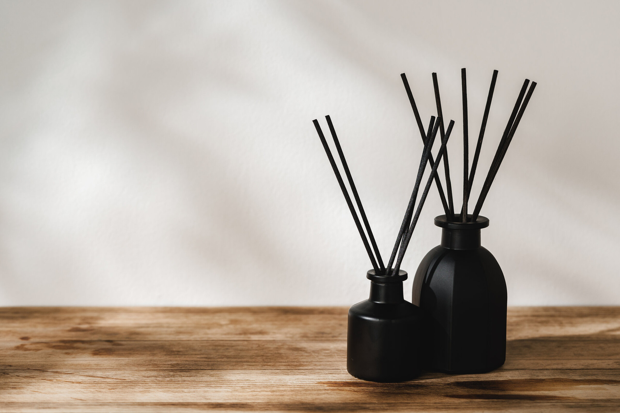 Reed diffusers on a wooden table