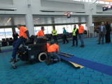 Dual-lift scraper easily removes commercial carpeting
