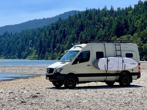 Mercedes Sprinter with surfboards carried on the side with Aluminess surf poles