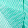 Close-up of green Clean Task Foodservice Wiper quarterfold sheets highlighting texture and absorbency.