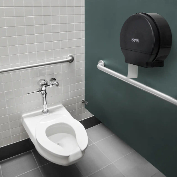 Commercial restroom featuring a Mayfair jumbo roll toilet paper dispenser providing reliable tissue access in high-traffic facilities