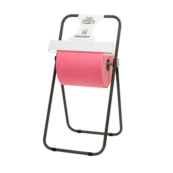 Pro Strength T800 red jumbo roll wiper mounted in a dispenser for easy tear-off in commercial and industrial settings.