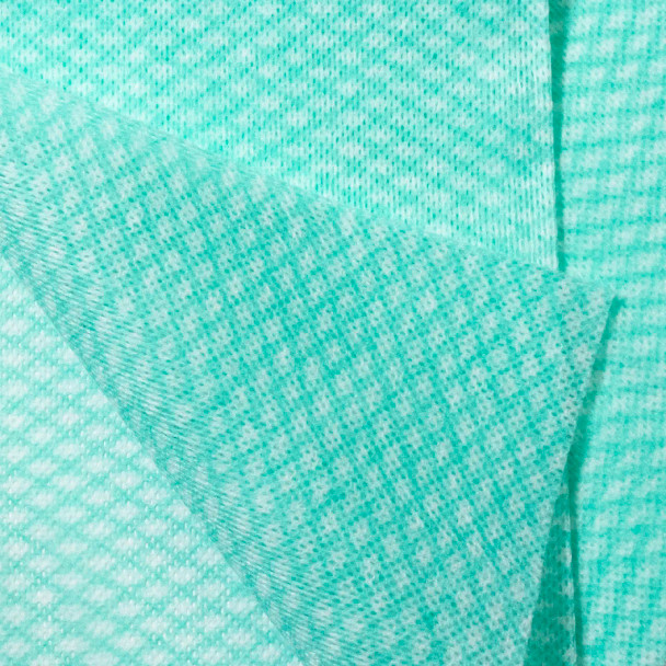Close-up of green Clean Task Foodservice Wiper quarterfold sheets highlighting texture and absorbency.